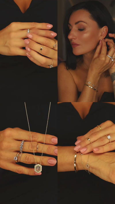 Zlatý bangle náramok CREYO STRUCTURA zo 14-karátového žltého zlata so zirkónmi a geometrickou vnútornou štruktúrou. Video zvýrazňuje pevný tvar, luxusný lesk a detailné remeselné spracovanie.